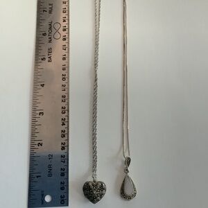 2 dainty necklaces.  Sterling silver Heart locket and  marcasite tear drop